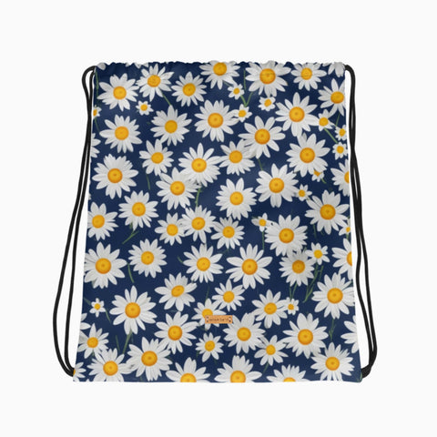 Turnbeutel mit Gänseblümchen-Muster, flach auf hellem Hintergrund ausgelegt.